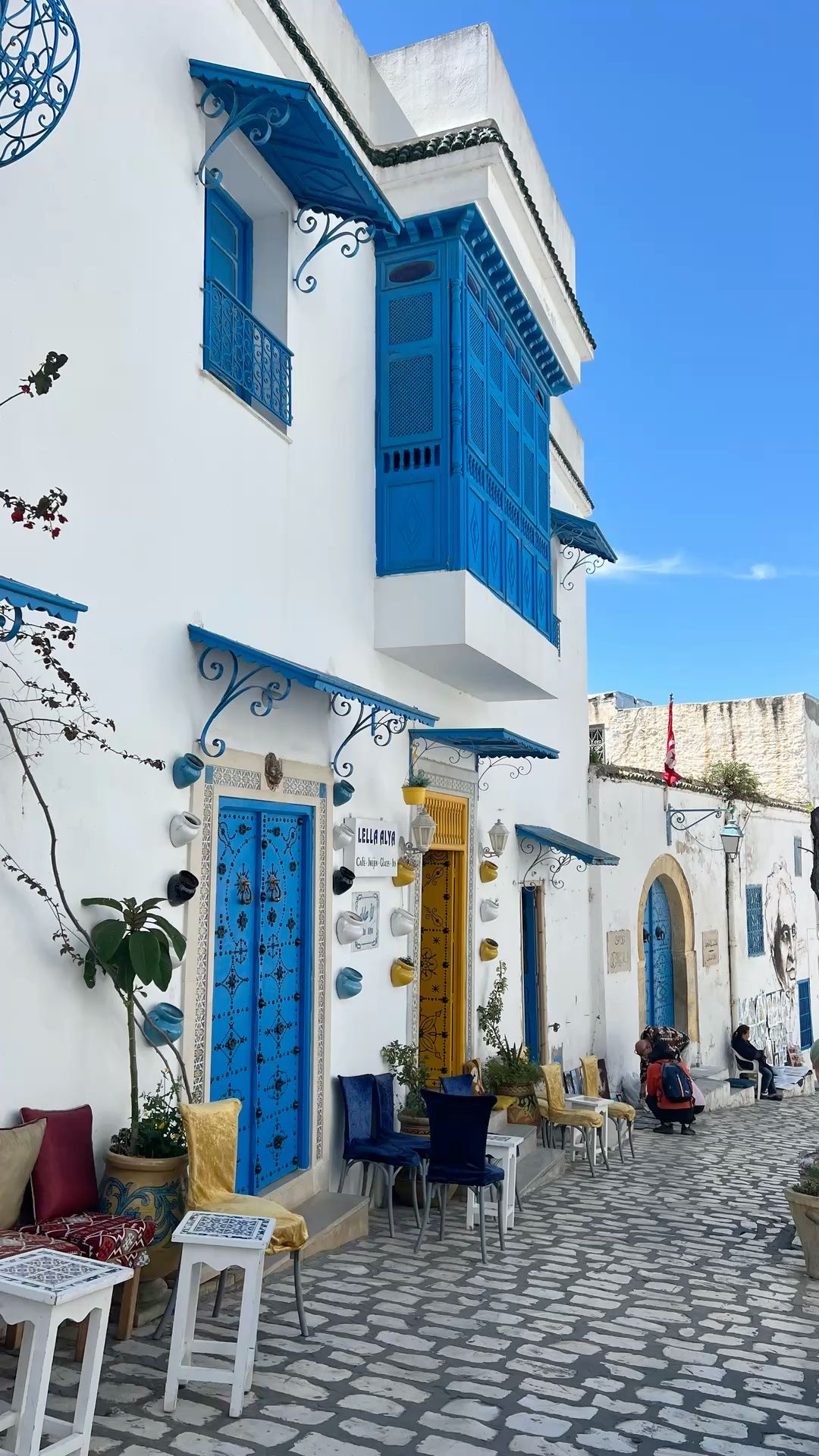 Cobbled street with blue balconies in Sidi Bou Said