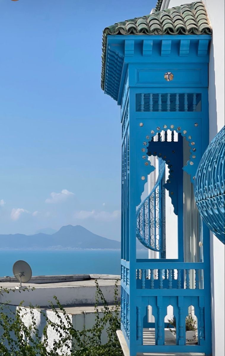 Blue wooden balcony overlooking the sea